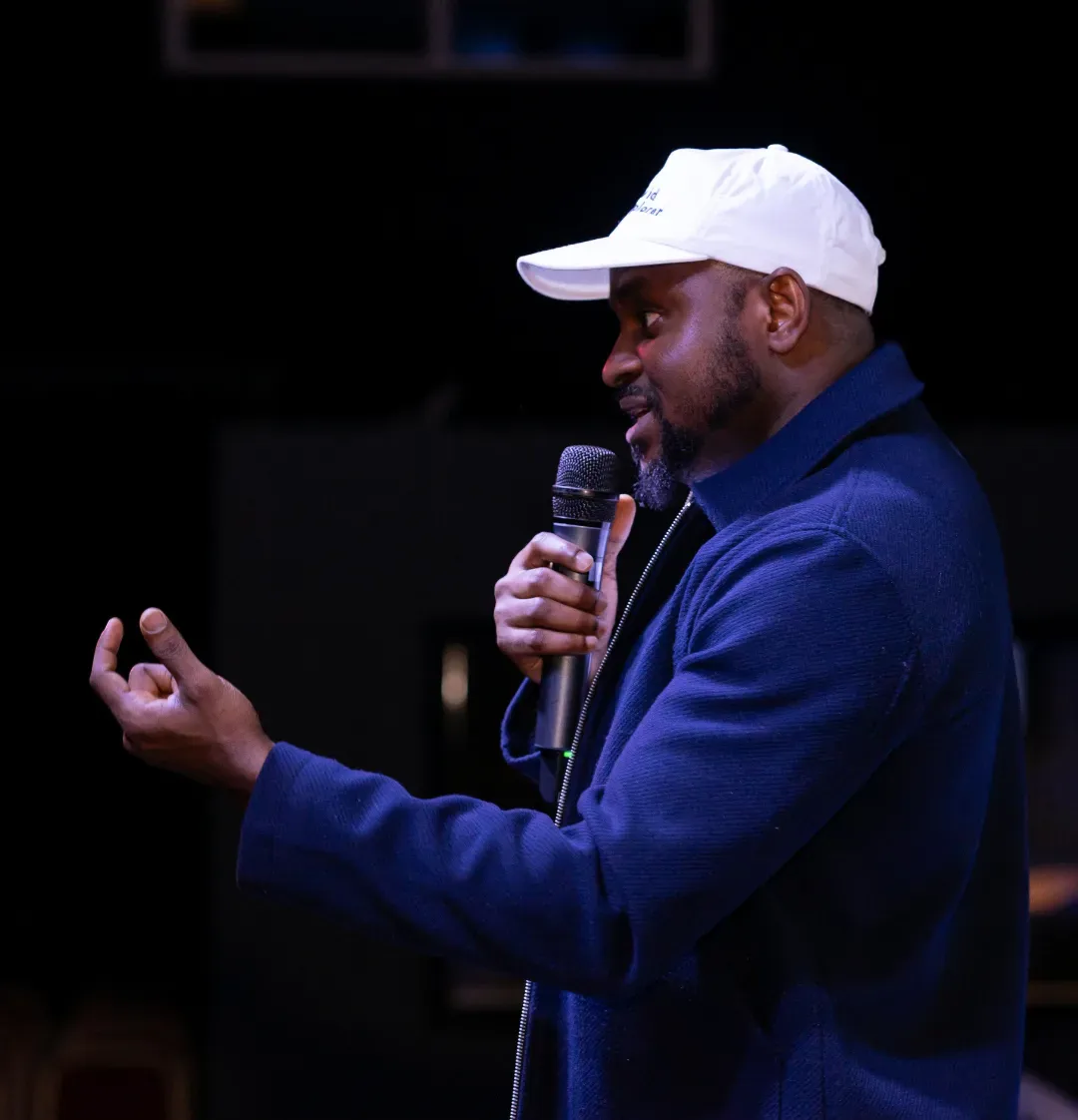 Dr. Victor Adekunle speaking at an event